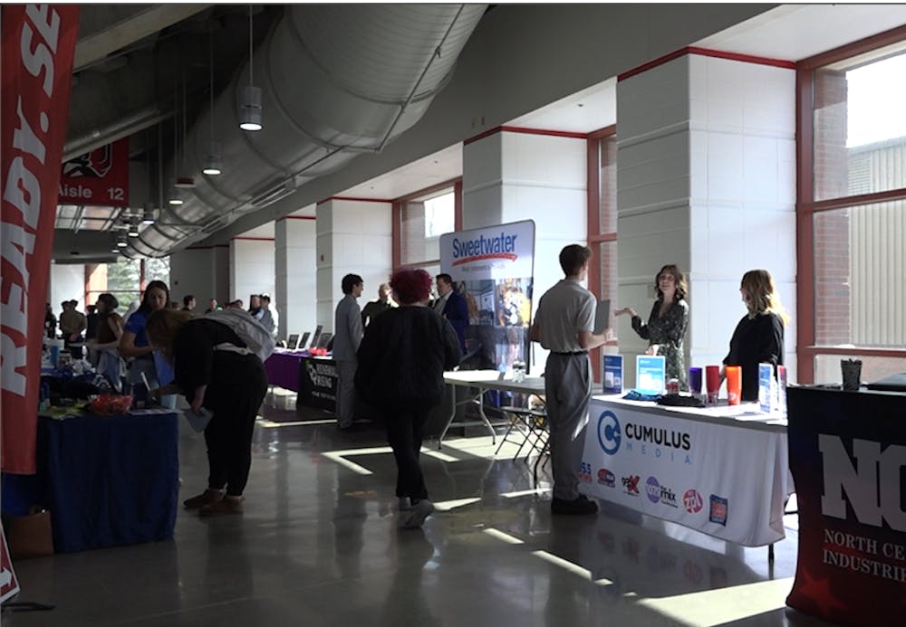 Tables line the perimeter of Worthen Arena in the Cardinal Job Fair.