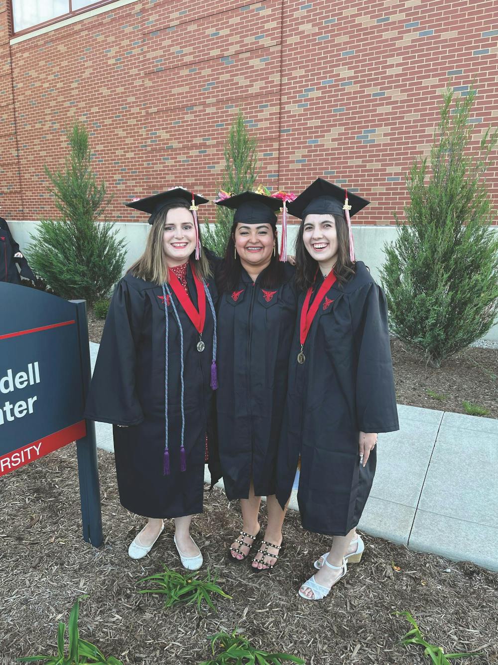 Savannah Oliphant (right) poses for a photo with fellow teaching graduates after graduating from Ball State University in the spring of 2022. Oliphant said she is still connected with many of her teaching friends from Ball State. Savannah Oliphant, Photo Provided