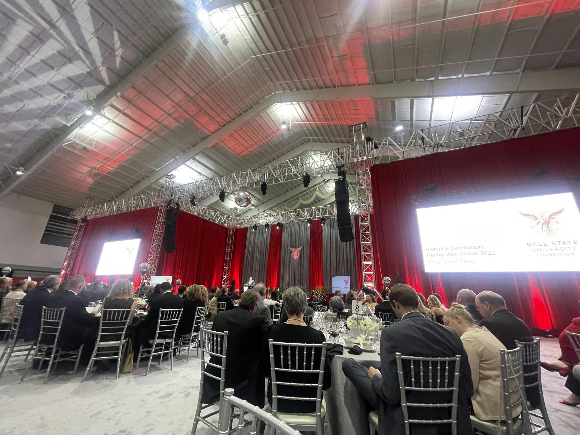 Attendees of the Alumni and Benefactors dinner listen to a speaker present Oct. 21, 2022 at Scheumann Family Indoor Practice Facility. Kinsey Reese, Photo Provided