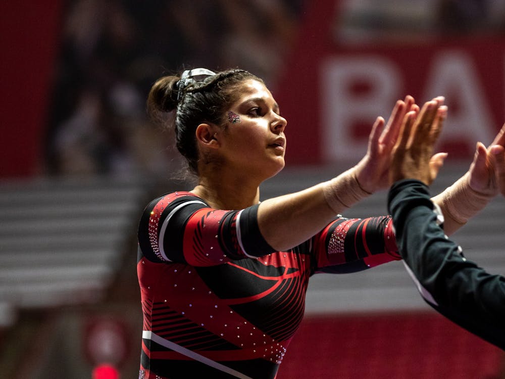 Ball State Senior, Rachel Benoit high fives her teammates as she completes the beam routine during the women's gymnastics home opener, Jan. 26, 2020 in John E. Worthen Arena. The Cardinals secured a win by putting up 194.2 points. Paul Kihn, DN