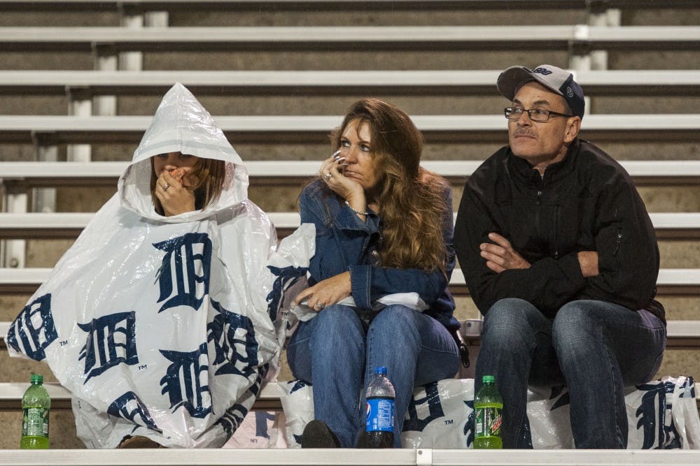 Fans, having made it through the adverse weather, watch the game against Toledo at the Glass Bowl on Sept. 21 from the stands. DN PHOTO JONATHAN MIKSANEK