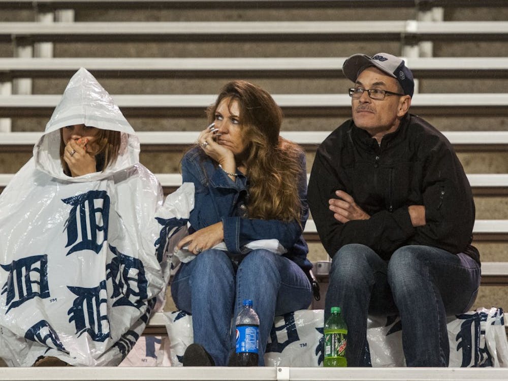 Fans, having made it through the adverse weather, watch the game against Toledo at the Glass Bowl on Sept. 21 from the stands. DN PHOTO JONATHAN MIKSANEK
