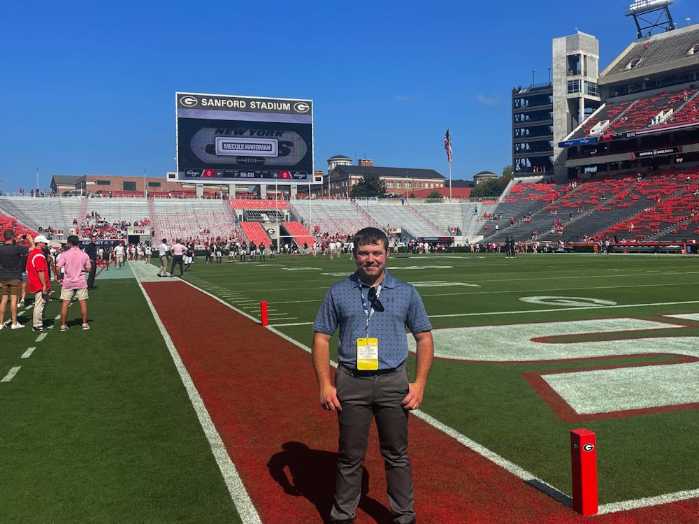 Sophomore reporter Zach Carter stands in front of Sanford Stadium in Athens, Ga Sept. 9 before Ball State’s game against No.1 Georgia. Elijah Poe, DN. 