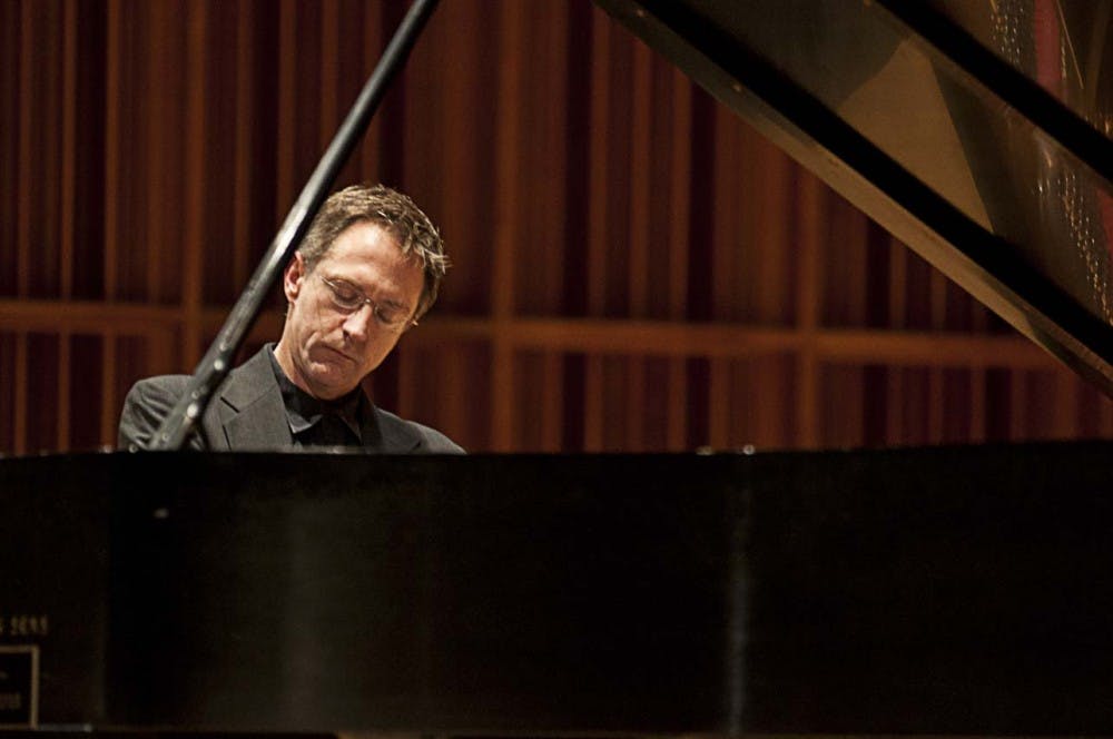 James Helton plays “Dusk (The Hour Glass)” as part of Pianopalooza III presented Sunday night in Sursa Hall. Proceeds from Pianopalooza benefited victims of Hurricane Sandy. Piano faculty members Helton, Lori Rhoden, Ray Kilburn and Robert Palmer performed. DN PHOTO JOANTHAN MIKSANEK