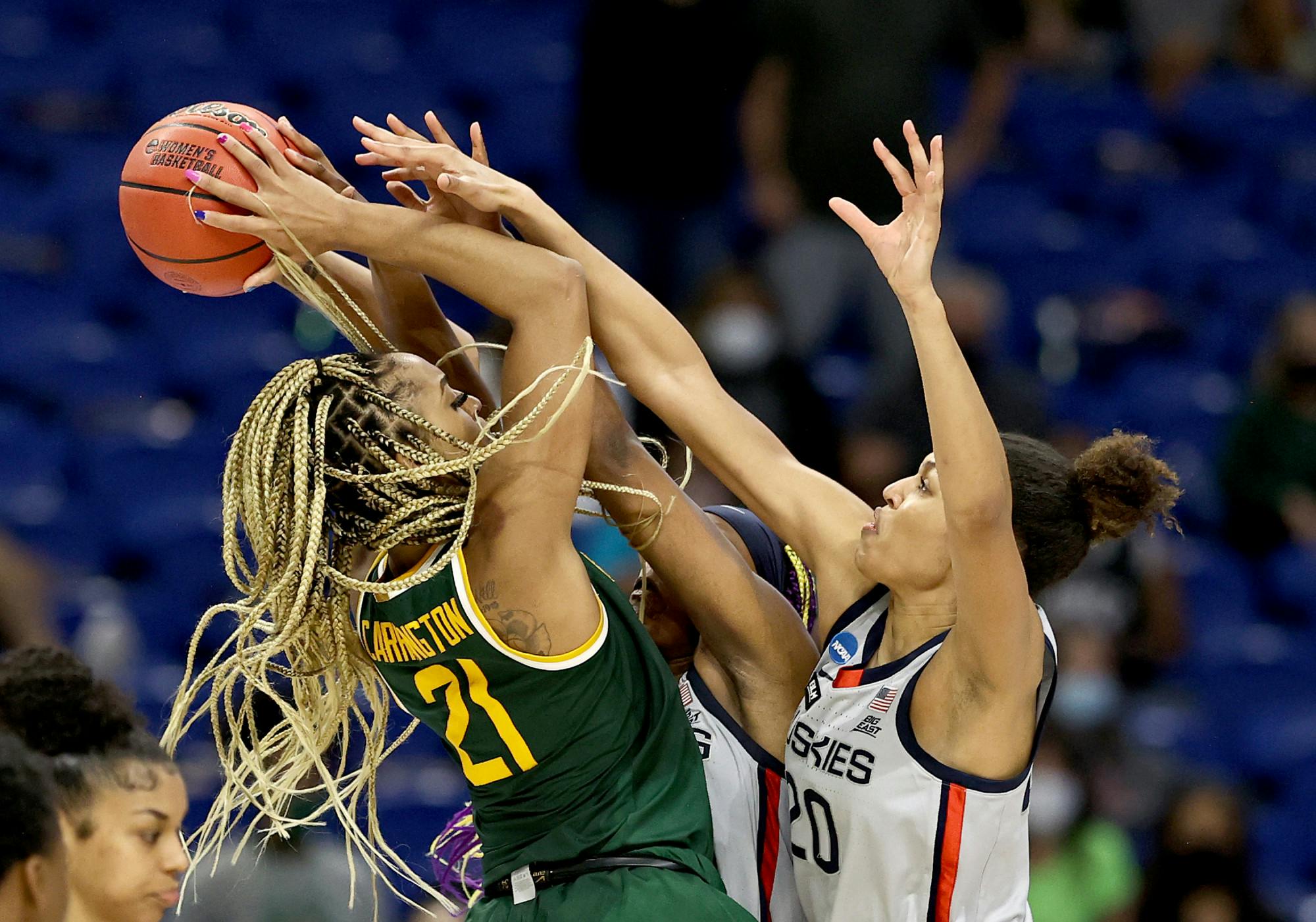 DiJonai Carrington #21 of the Baylor Lady Bears tries to take a shot as Aaliyah Edwards #3 and Olivia Nelson-Ododa #20 of the UConn Huskies defend in the final minutes of the game during the Elite Eight round of the NCAA Women's Basketball Tournament at the Alamodome on March 29, 2021 in San Antonio, Texas.The UConn Huskies defeated the Baylor Lady Bears 69-67 to advance to the Final Four. (Elsa/Getty Images/TNS)