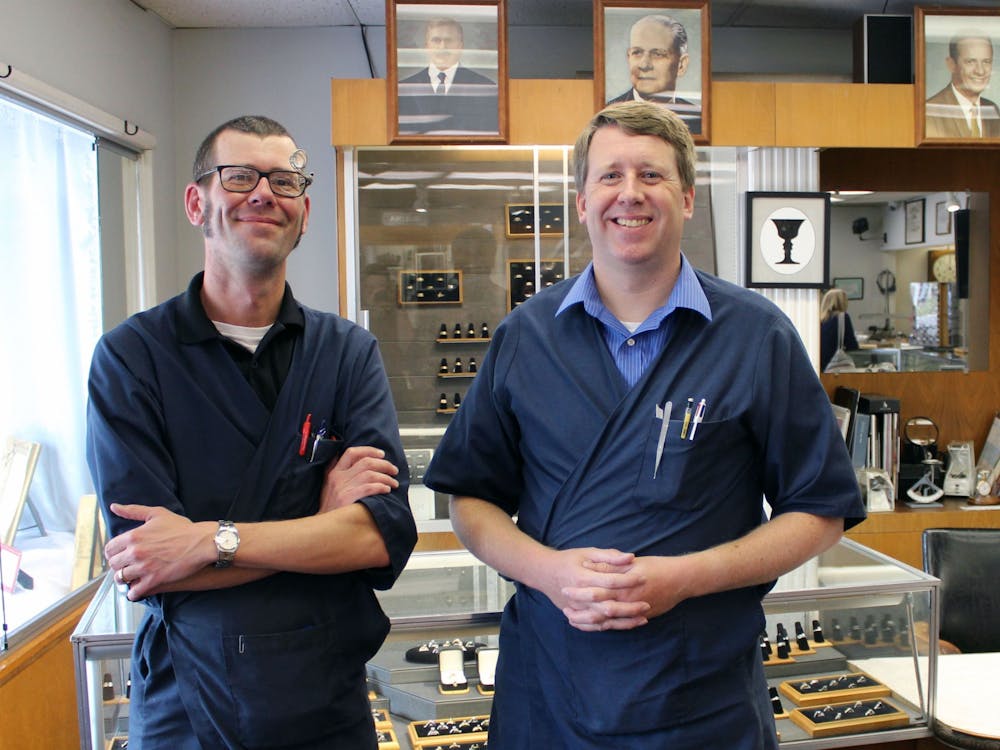 James Murray (left) and Ryan Murray (right) stand in front of a display case at Murray Jewelers. The two are co-owners and the fifth generation in their family to run the business. Maya Wilkins, DN