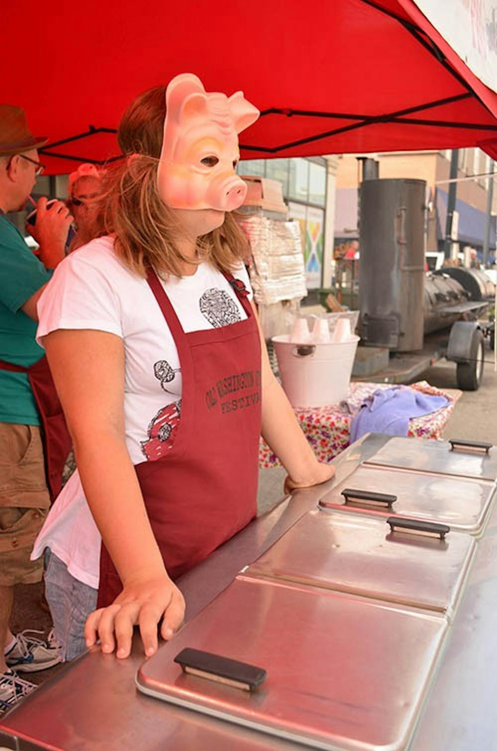 Emily Steiner sells halos, T-shirts and cider slushies at last year’s Muncie RibFest. Steiner worked for the Old Washington Street Festival booth. DN FILE PHOTO SHAE GIST