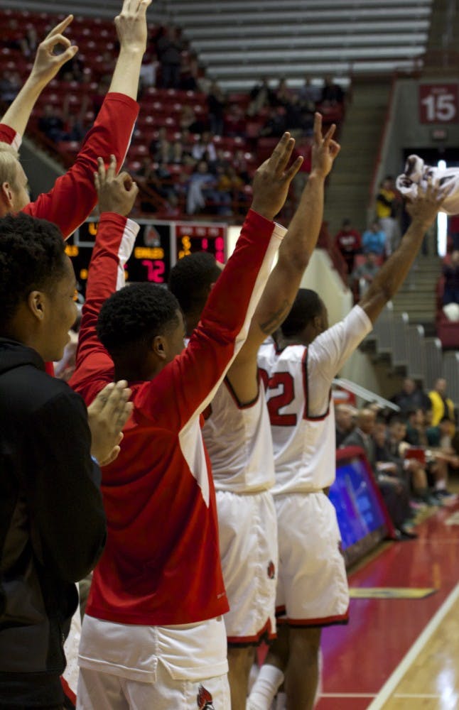 The Ball State men’s basketball team cheers from the sidelines as one of its teammates scores a basket in the game against Eastern Michigan on Feb. 27 in Worthen Arena. The Cardinals beat their record of highest number of points since 1989, scoring 115 to 79. DN PHOTO GRACE RAMEY