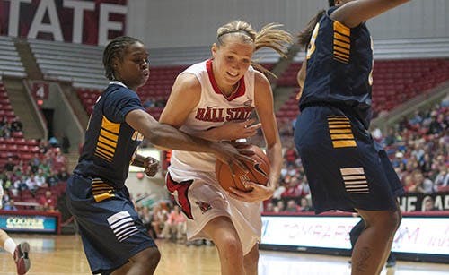 Sophomore guard Brittany Carter pushes past a Toledo player as she makes a rebound during a game Feb. 10, 2013 in Worthen Arena. DN FILE PHOTO BOBBY ELLIS
