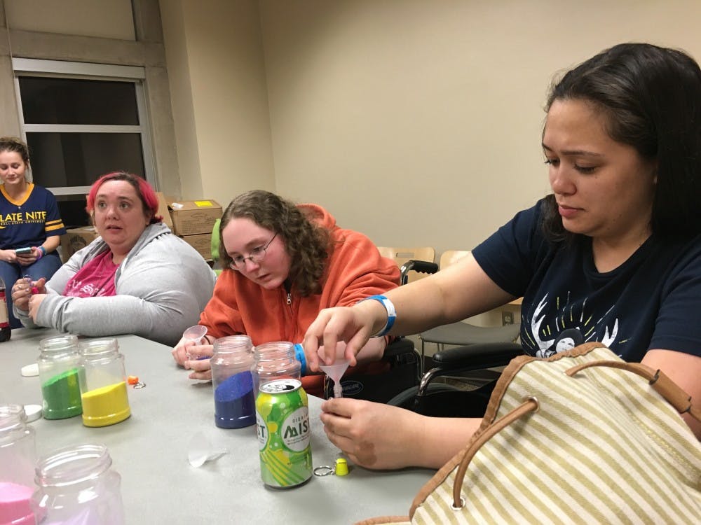 The Alliance for Disability Awareness is working to bring awareness to the fact there are limitations for students with disablilities who attend activies, like Late Nite. Lauren Slaven, vice president of ADA, and graduate student Keiuma Bennett first had problems with getting to Late Nite because there was no transportation. DN PHOTO MICHELLE KAUFMAN