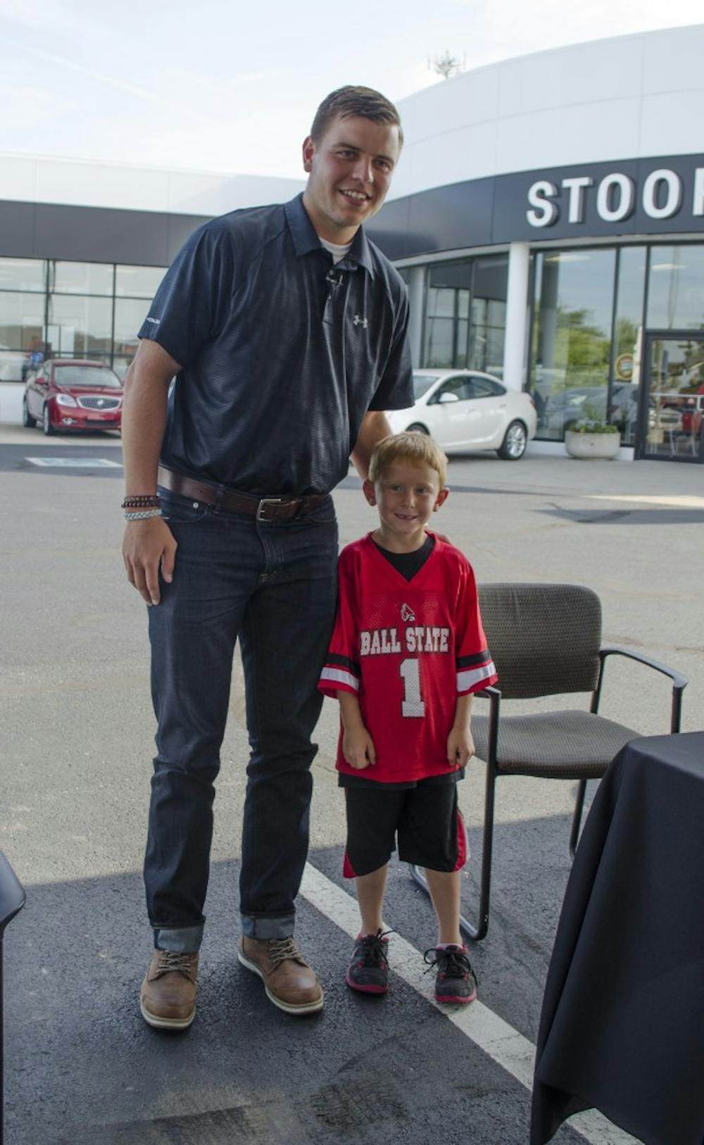 Keith Wenning poses for a photo with Keith Siefring on July 11 at the meet and greet at Stoops Automotive. DN PHOTO BREANNA DAUGHERTY