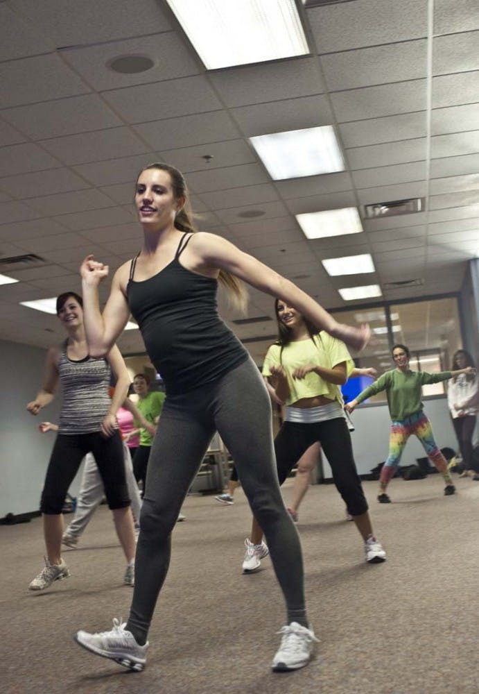 Senior dance major Rachel Brown joins fellow students at Christmas Zumba on Wednesday evening at the L.A. Pittenger Student Center. The Zumba event was organized to raise money for Timmy Global Health. DN PHOTO JONATHAN MIKSANEK