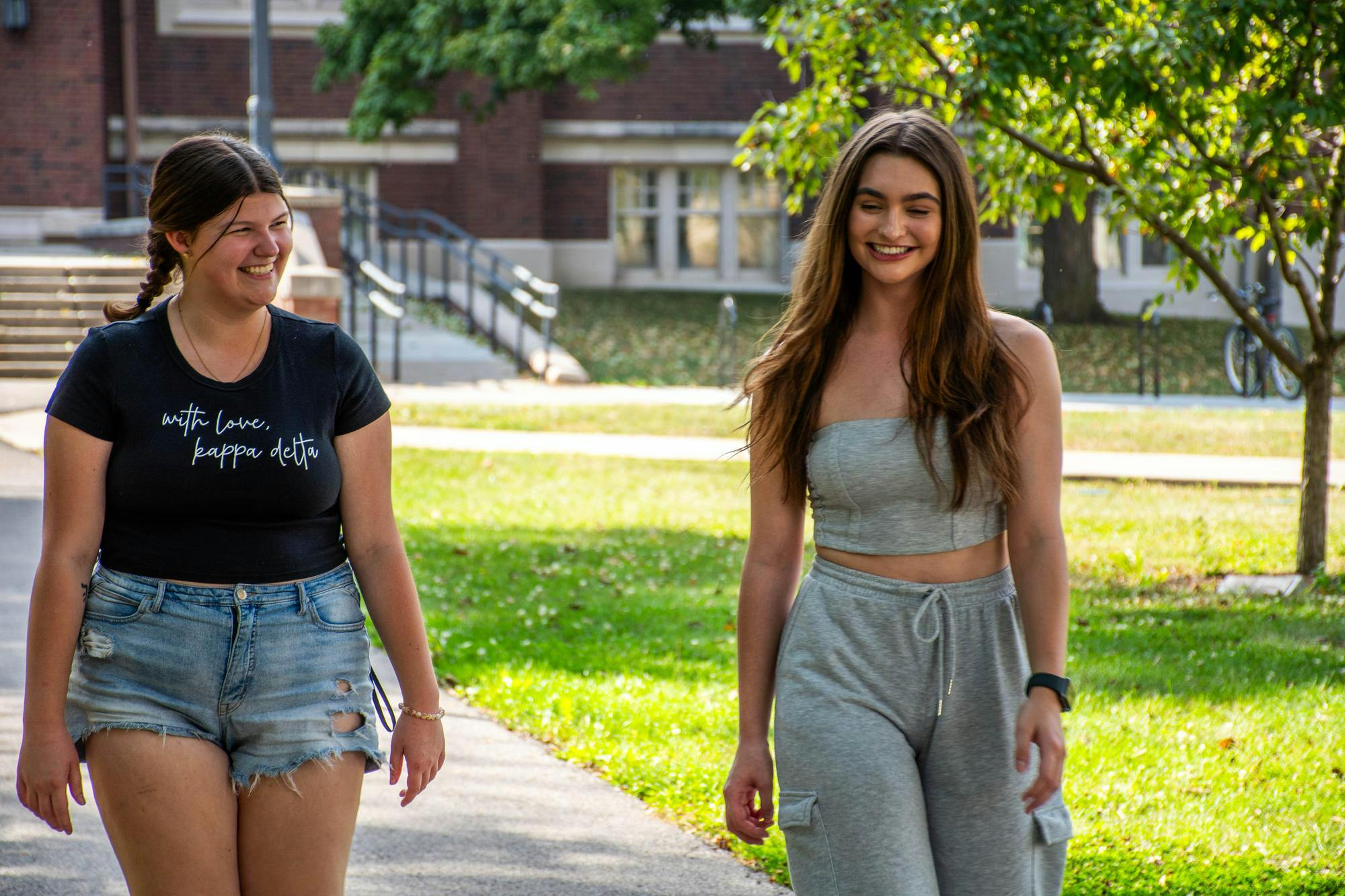 Third year Liberty Rister and Jayden Vaughn walk down a sidewalk with each other Sept. 29 outside of Ball Gymnasium. Kadin Bright, DN