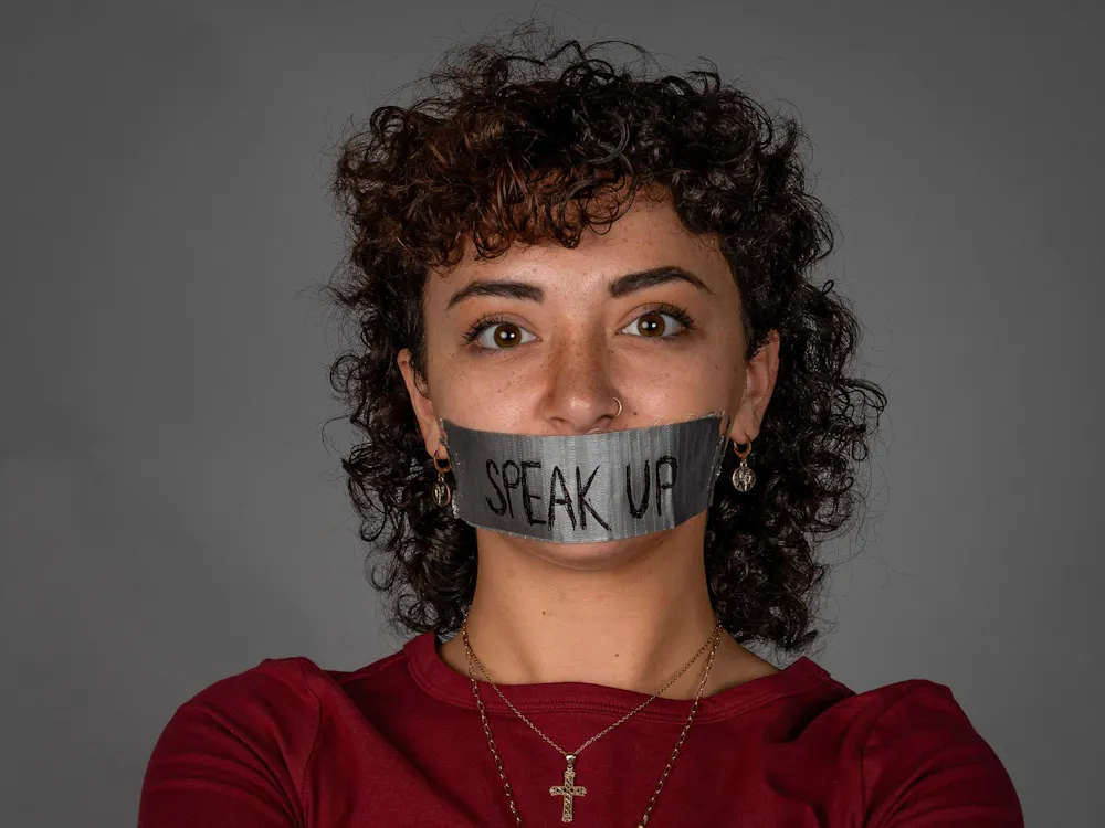 First-year Strategic Communications major Bentley Ford photographed with tape over mouth Nov. 11 in the Arts and Journalism Building. Kyle Ingermann, DN