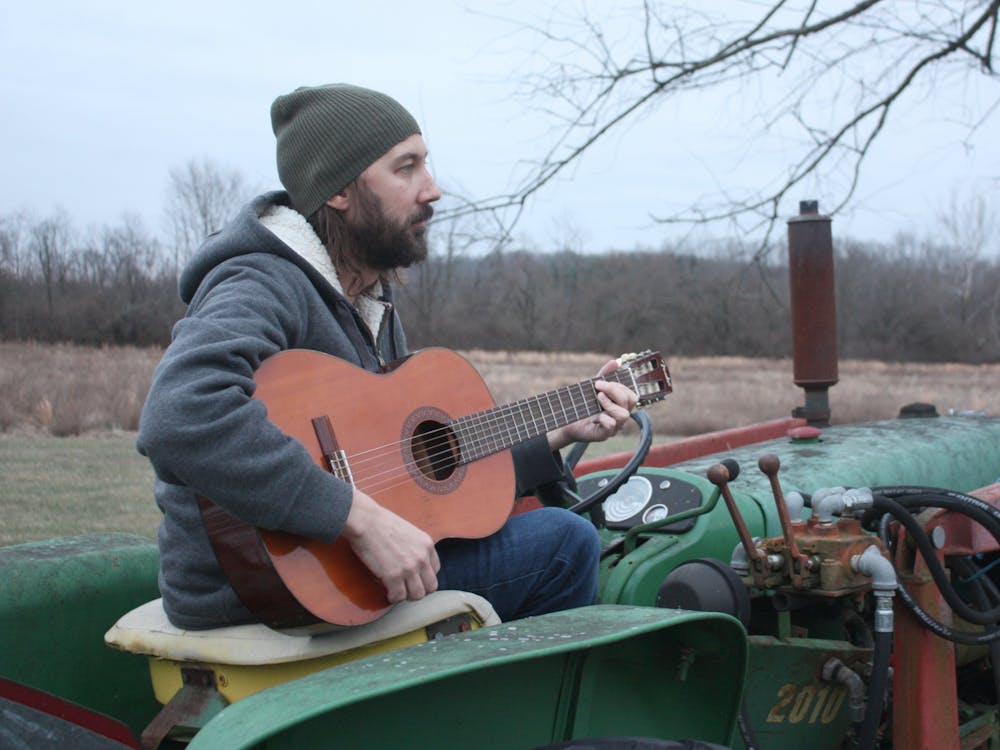 Andrew Gustin, owner of Ameliorate Records and curator of &quot;Two Minutes in Indiana&quot; poses with his guitar Jan. 17, 2022. Gustin played his own track called &quot;Willow Tree&quot; on the album alongside individual compositions from 19 other Indiana musicians. Laura Hergenroether, Photo Provided