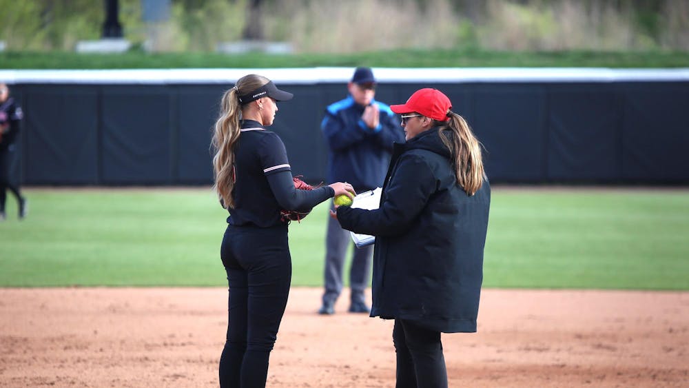 Senior starting pitcher Francys King gives the ball to head coach Helen Peña April 24 during a game against Purdue at Bittinger Stadium in West Lafayette. Ball State fell 6-2. Zach Carter, DN. 