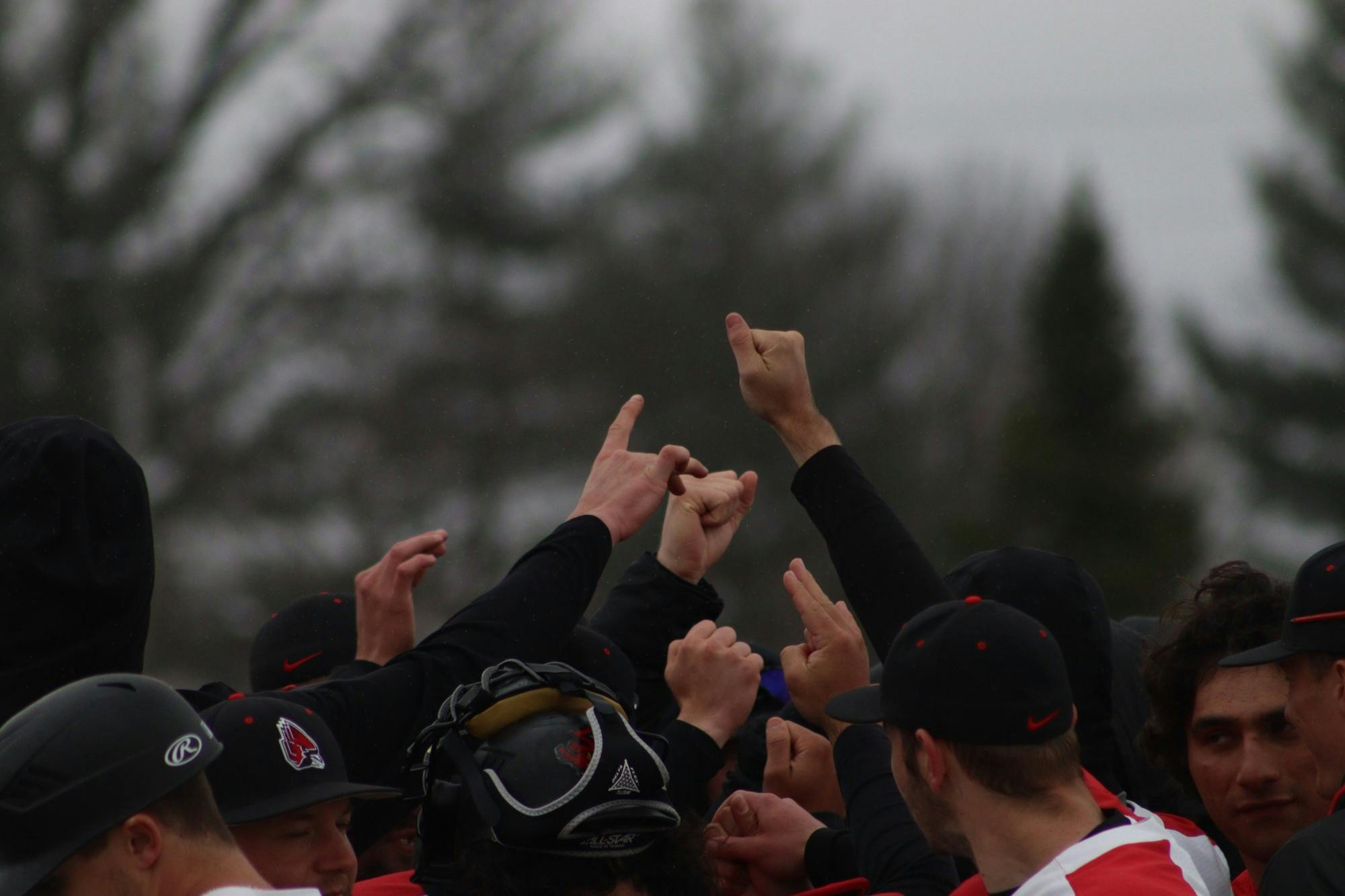 Baseball players huddle after the game against Bowling Green at the First Merchant Baseball Complex on March 19. Cardinals won 17-1. Jamie Howell, DN