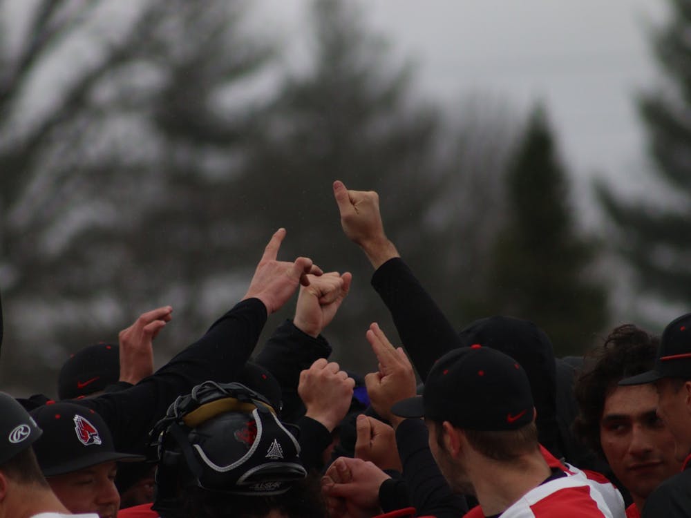 Baseball players huddle after the game against Bowling Green at the First Merchant Baseball Complex on March 19. Cardinals won 17-1. Jamie Howell, DN