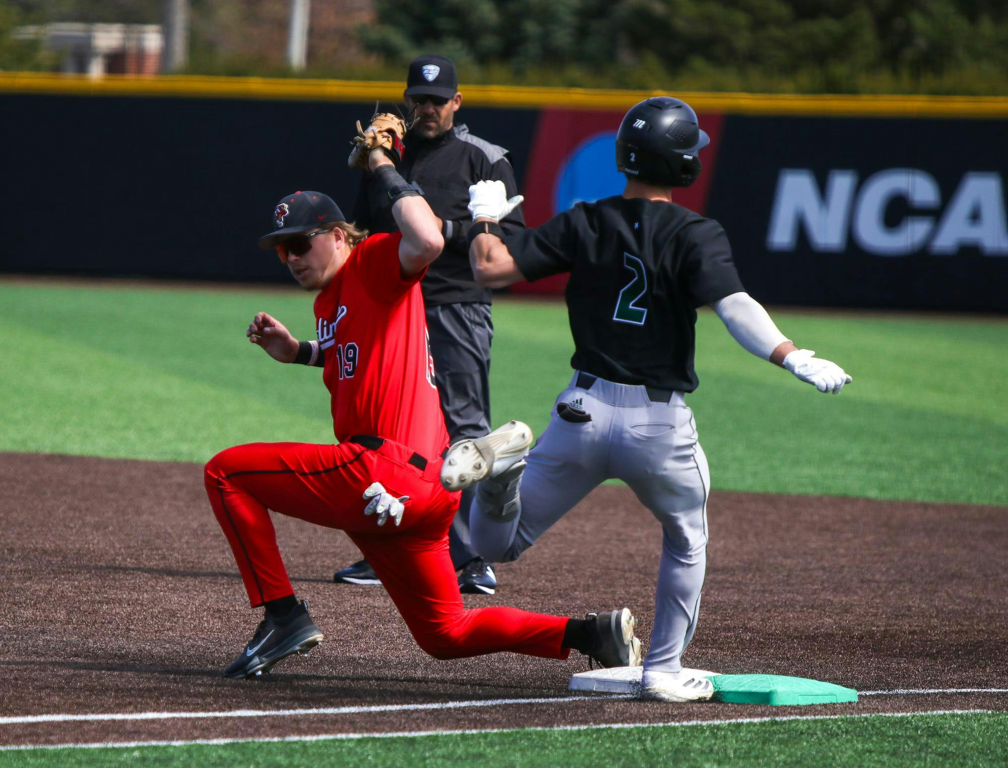 Ball State junior first baseman Jacob Gillis catches the ball to put out Ohio fifth year infielder Will Henson March 29 at Shebek Stadium. Gillis has a season high of 12 putouts. Adam Jones, DN