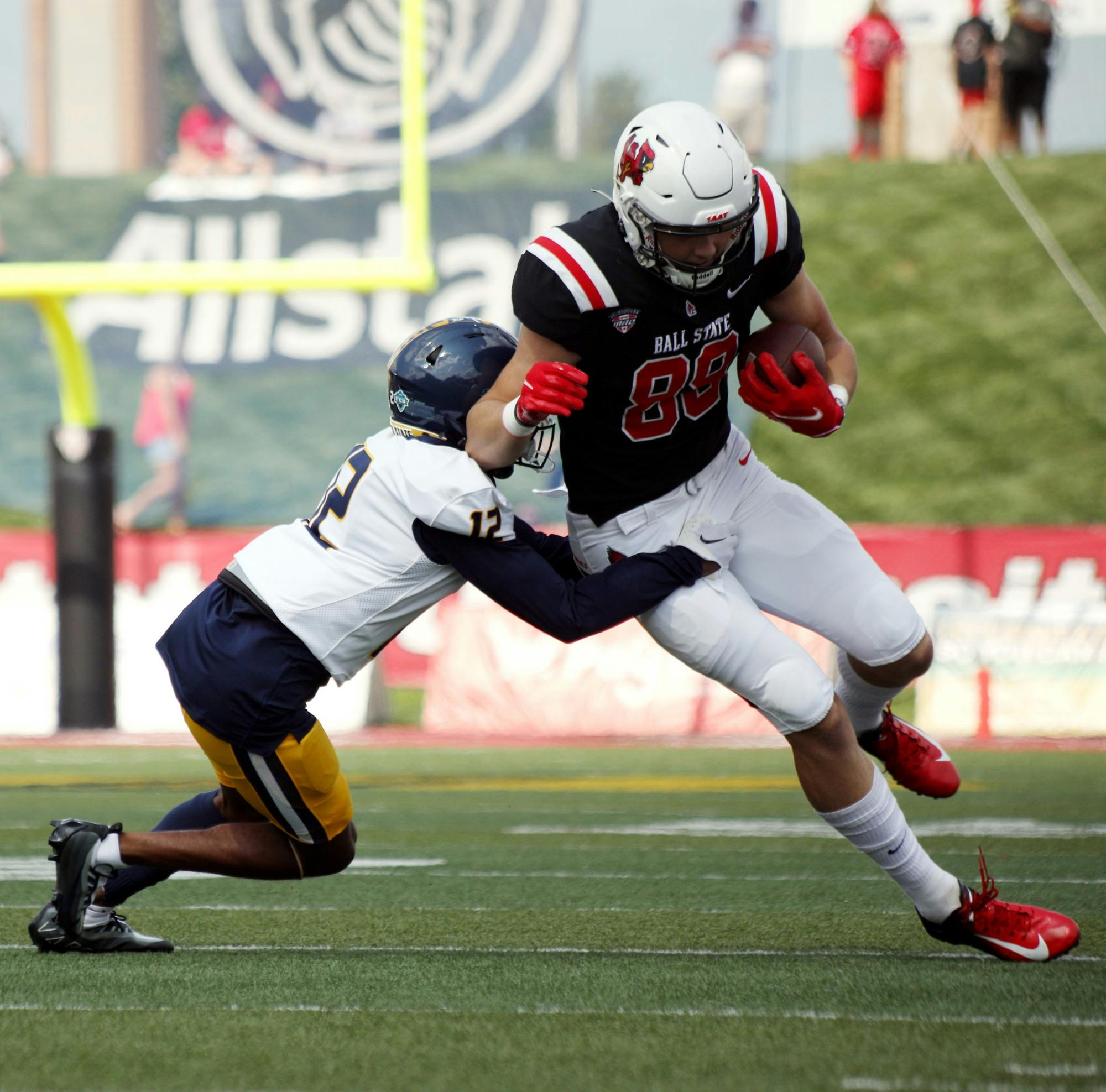 Freshman tight end Tanner Koziol runs with the football in a game against Murray State at Sheumann Stadium Sept. 17. Koziol had six receptions and one touchdown during the game. Amber Pietz, DN