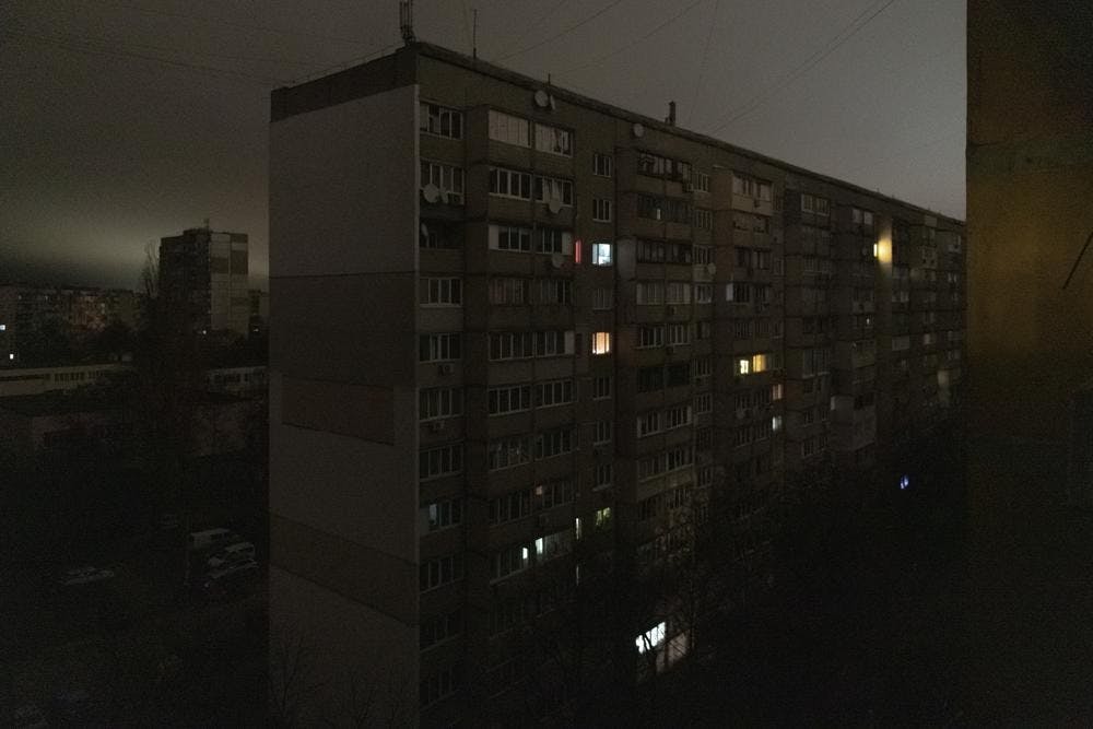 <p>Windows of an apartment building are illuminated during a blackout in central Kyiv, Ukraine, Monday, Nov. 14, 2022. (AP Photo/Andrew Kravchenko)</p>