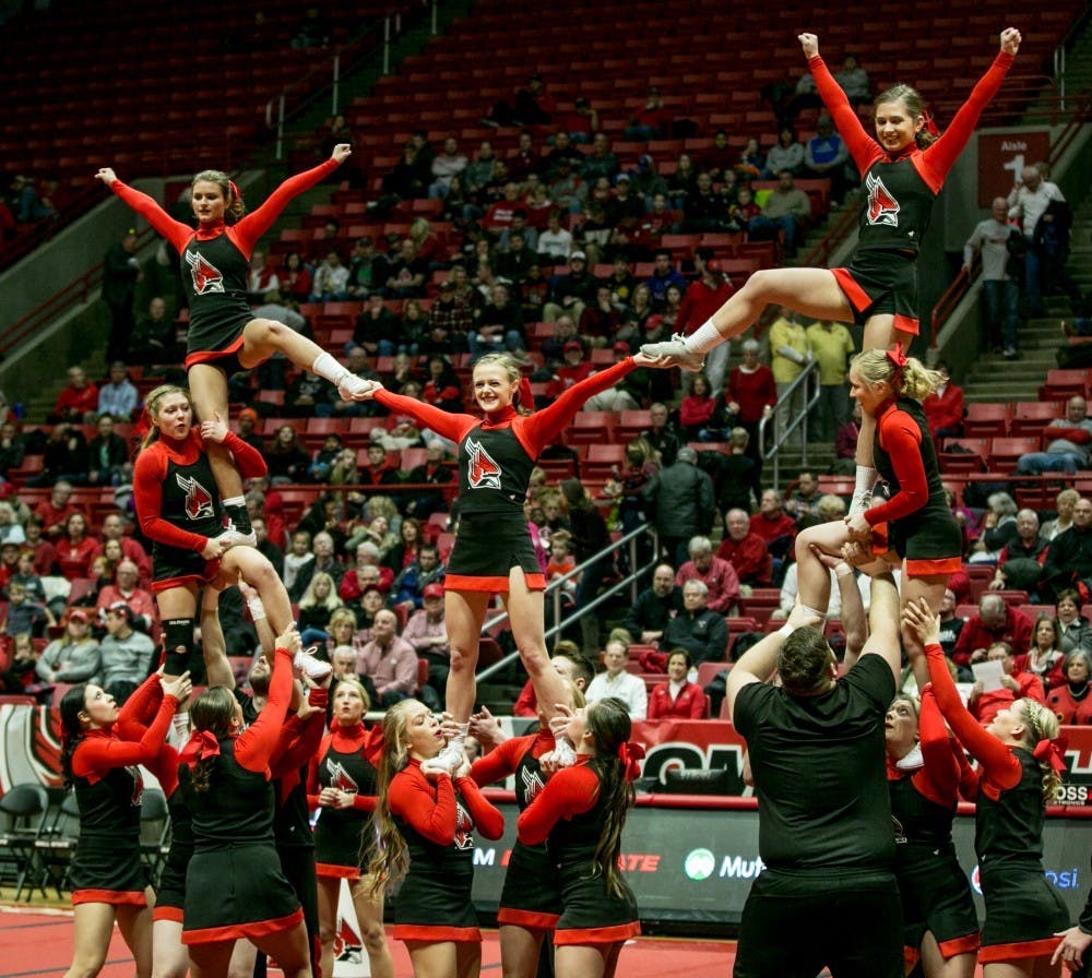 <p>Cheerleaders perform at half time during the game against Buffalo Jan. 6 in John E. Worthern Arena. There are two cheer squads at Ball State, a co-ed and an all-girl team. <strong>Kaiti Sullivan</strong></p>
