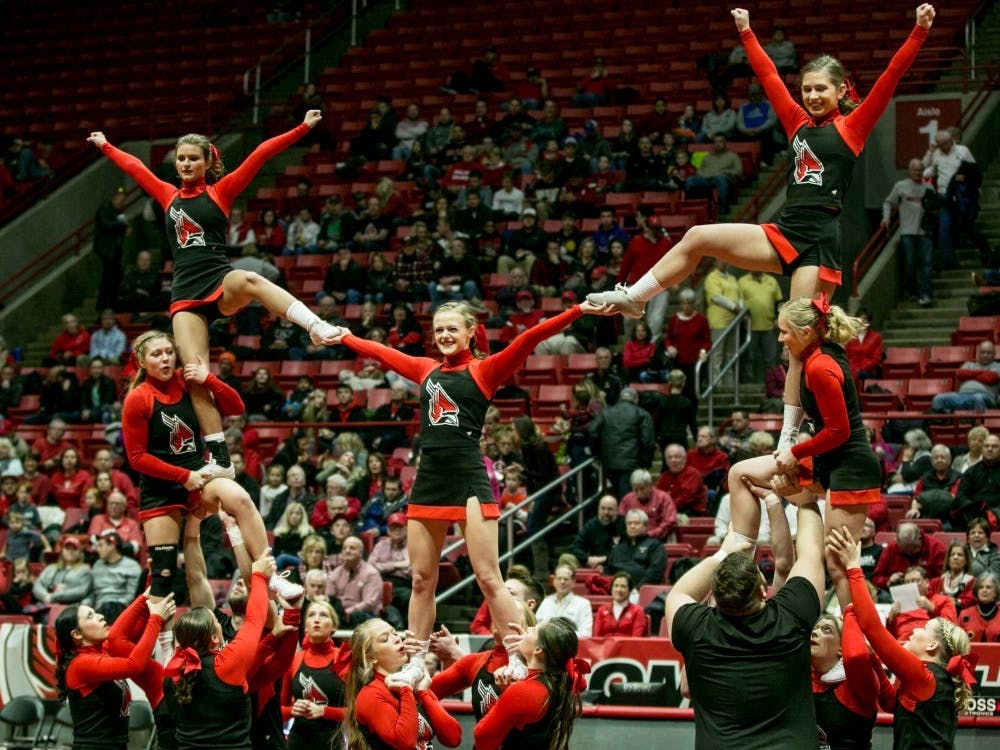 Cheerleaders perform at half time during the game against Buffalo Jan. 6 in John E. Worthern Arena. There are two cheer squads at Ball State, a co-ed and an all-girl team. Kaiti Sullivan