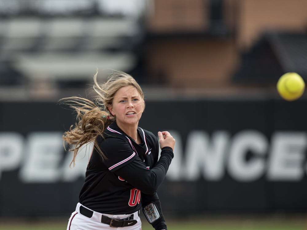 Freshman infielder Kaitlyn Gibson throws the ball during a fielding exercise before Ball State Softball's game against Kent State April 2 at the First Merchants Ballpark Complex. Gibson came into the game as a pinch runner and scored for the Cardinals in the bottom of the third inning. Eli Houser, DN