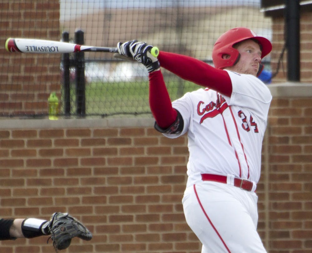 Caleb Stayton, a junior first baseman for the Ball State Cardinals, attempts to hit the ball while up to bat in the game against Ohio on April 1. The Cardinals’ 2017 schedule will feature a game against Coastal Carolina, the defending national champion.  Grace Ramey//DN File