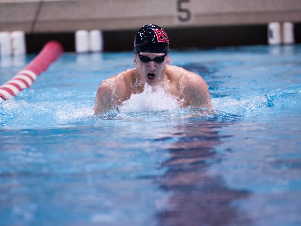 Freshmen Mitch Prather swims the men's 200-yard individual melody event at the 10th annual Doug Coers Invitational at the Lewellen Aquatic Center. DN PHOTO KATIE GRAY