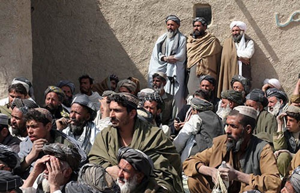 Locals at a mosque in Najiban, Afghanistan, listen, March 13, 2012, as members of a high-level Afghan government discuss the massacre that killed 16 residents from Najiban and Alkozai villages. Robert Bales plead guilty to the murders this week. MCT PHOTO