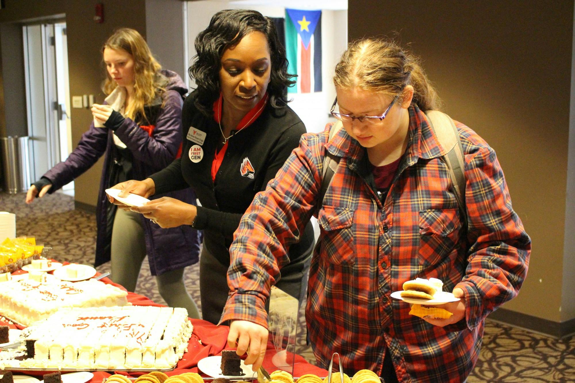 Ro-Anne Royer Engle, interim vice president for student affairs, talks with a student Nov. 8, 2019, at the Student Center Terrace Lounge. Ball State Student Affairs offered cake, cookies, punch and goodies for attendees at its "I Am First Generation Celebration" event. Bailey Cline, DN
