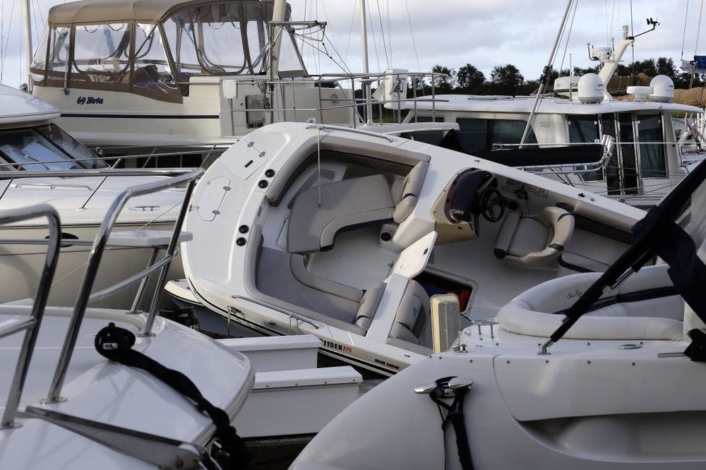 Boats are piled on each other at the Southport Marina following the effects of Hurricane Isaias in Southport, N.C., Tuesday, Aug. 4, 2020. (AP Photo/Gerry Broome)