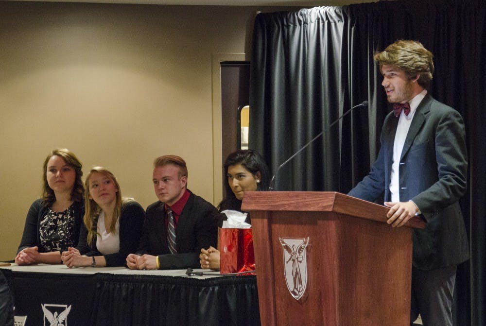 Atlas President Jack Hesser gave his first speech as president of the Student Government Association on April 15 in the L.A. Pittenger Student Center. Hesser, a microbiology and botany major, compared his executive board to the Bacteriophage T4 virus because of the way the members work together. DN PHOTO BREANNA DAUGHERTY