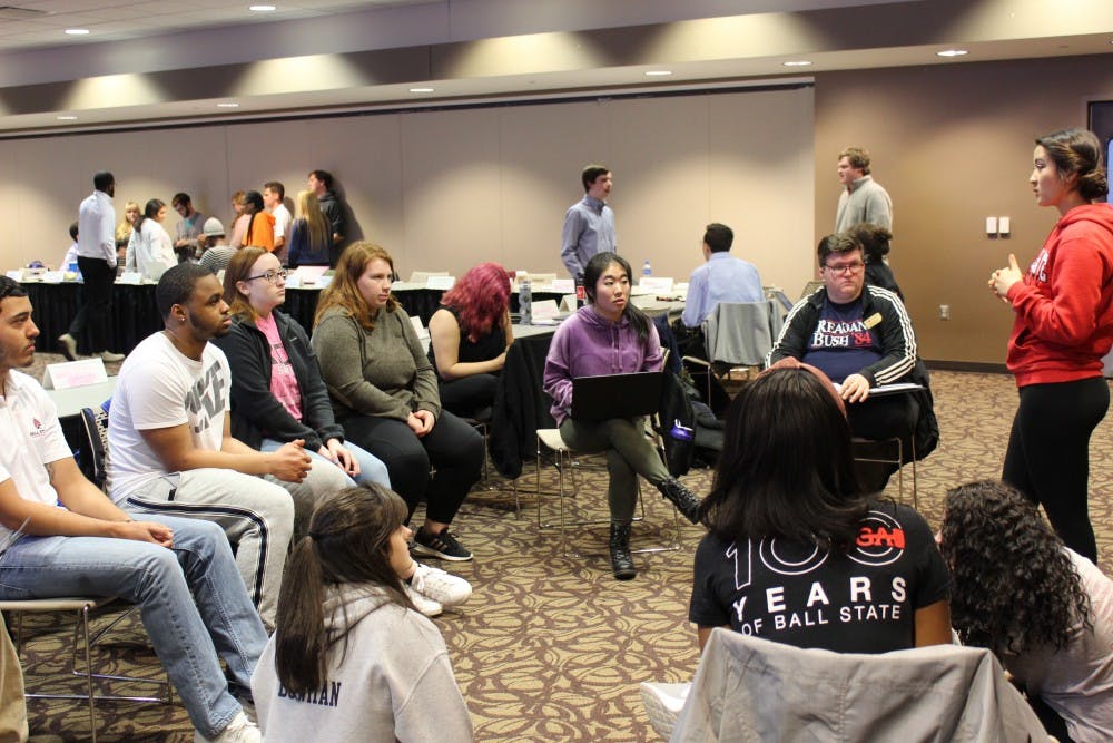 Myriam Bevelle addresses her caucus for a five minute meeting on Wednesday March 13 at the L.A. Pittenger Student Center. President Isaac Mitchell vetoed a resolution co-authored by Myriam, requiring cabinet members to report to the senate. Charles Melton, DN