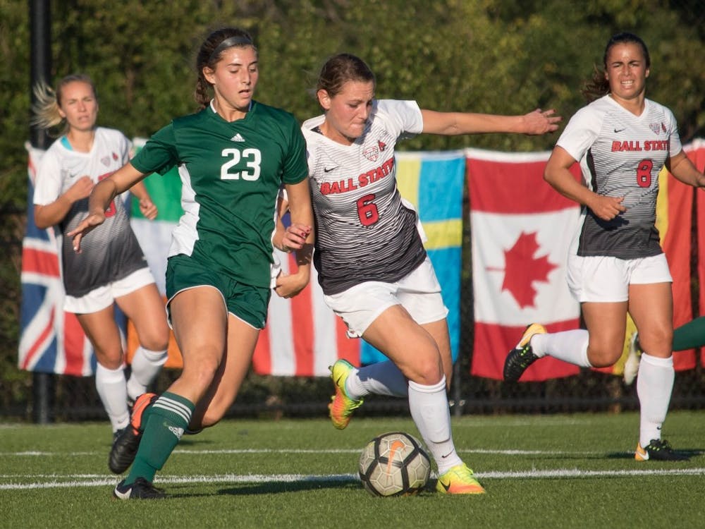 Senior Lucy Walton pushes against Eastern Michigan University player Lindsey Shira on Oct. 13 at Briner Sports Complex. Walton is a midfielder and defender for Ball State University. Rebecca Slezak,DN