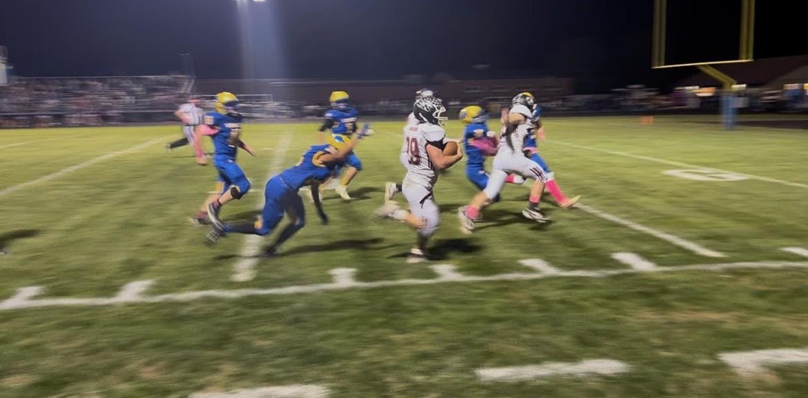 Brock Nauman running up the sideline. Wes-Del improves to 5-3 for the season going into Sectionals. 
