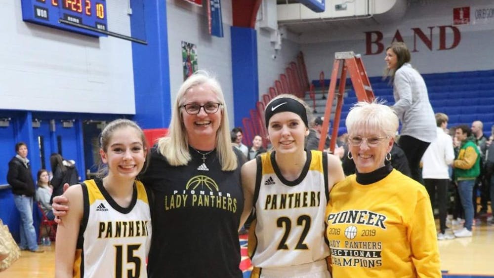 Tracy Roller (middle left) poses for a photo with Ashlynn Brooke (far left), Olivia Brooke (middle right) and Sue Roller (far right) at Canton High School in 2021. Roller is a former Ball State women's basketball head coach and Ashlynn is currently on the Cardinals' women's basketball team. Tracy Roller, Photo Provided