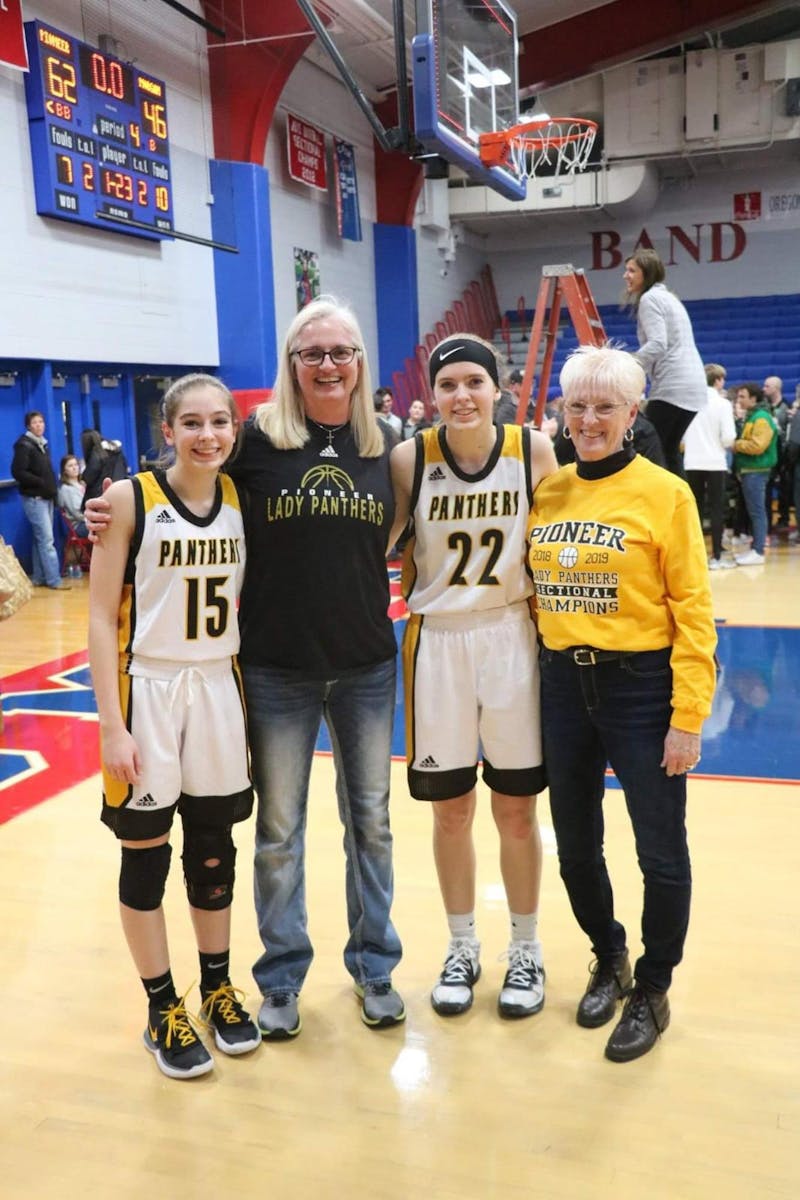 Tracy Roller (middle left) poses for a photo with Ashlynn Brooke (far left), Olivia Brooke (middle right) and Sue Roller (far right) at Canton High School in 2021. Roller is a former Ball State women's basketball head coach and Ashlynn is currently on the Cardinals' women's basketball team. Tracy Roller, Photo Provided