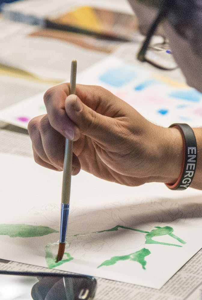 Ball State students paint water color pictures during the Asian American Student Association's month of events. Water Painting was the first event of the month. DN PHOTO RACHEL BRAMMER