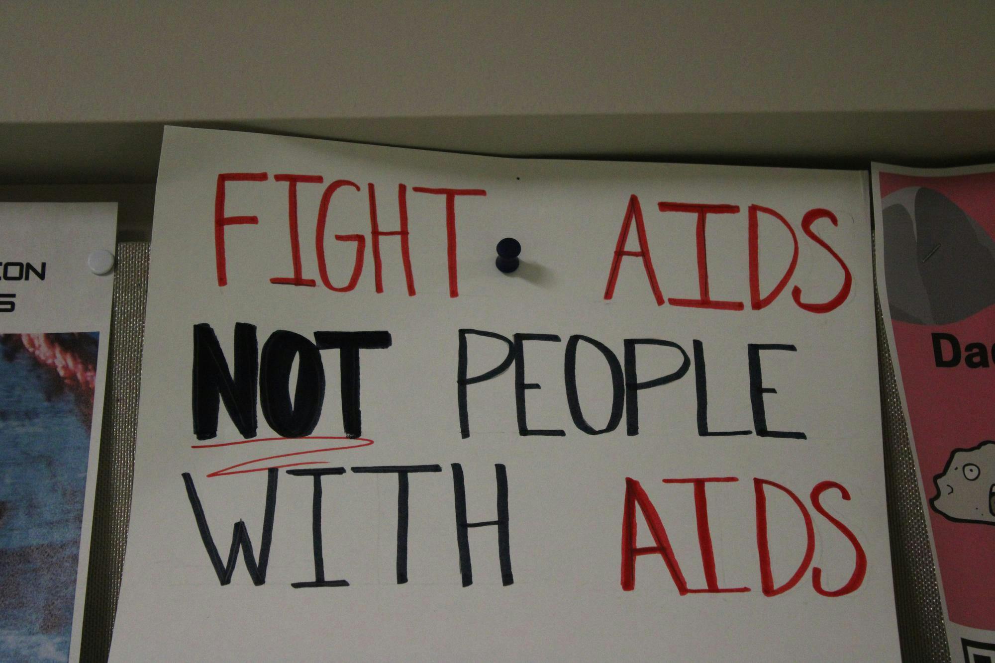 A poster advocating for AIDS support services hangs in the Applied Technology Building on Ball State University’s campus. Ball State students and faculty collaborate with Muncie community members through the Addictions Coalition of Delaware County, a partnership that provides grant-writing help and training programs. Adam Altobella, Photo Provided