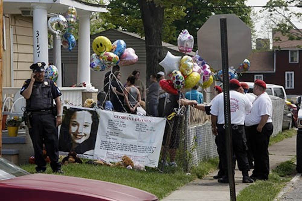Police guard the home of Gina DeJesus in Cleveland, Ohio, on Tuesday. DeJesus, Amanda Berry and Michelle Knight had allegedly been held captive in a Cleveland house since their teens or early 20s. MCT PHOTO
