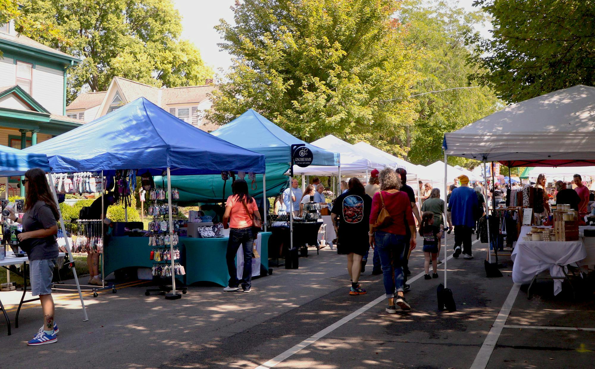 Attendees look at the local vendor's booths during the 48th Old Washington Street Festival on Sept. 14 in Muncie Ind. The festival included artisan vendors, live music, food trucks and historic home tours. Jessica Bergfors, DN