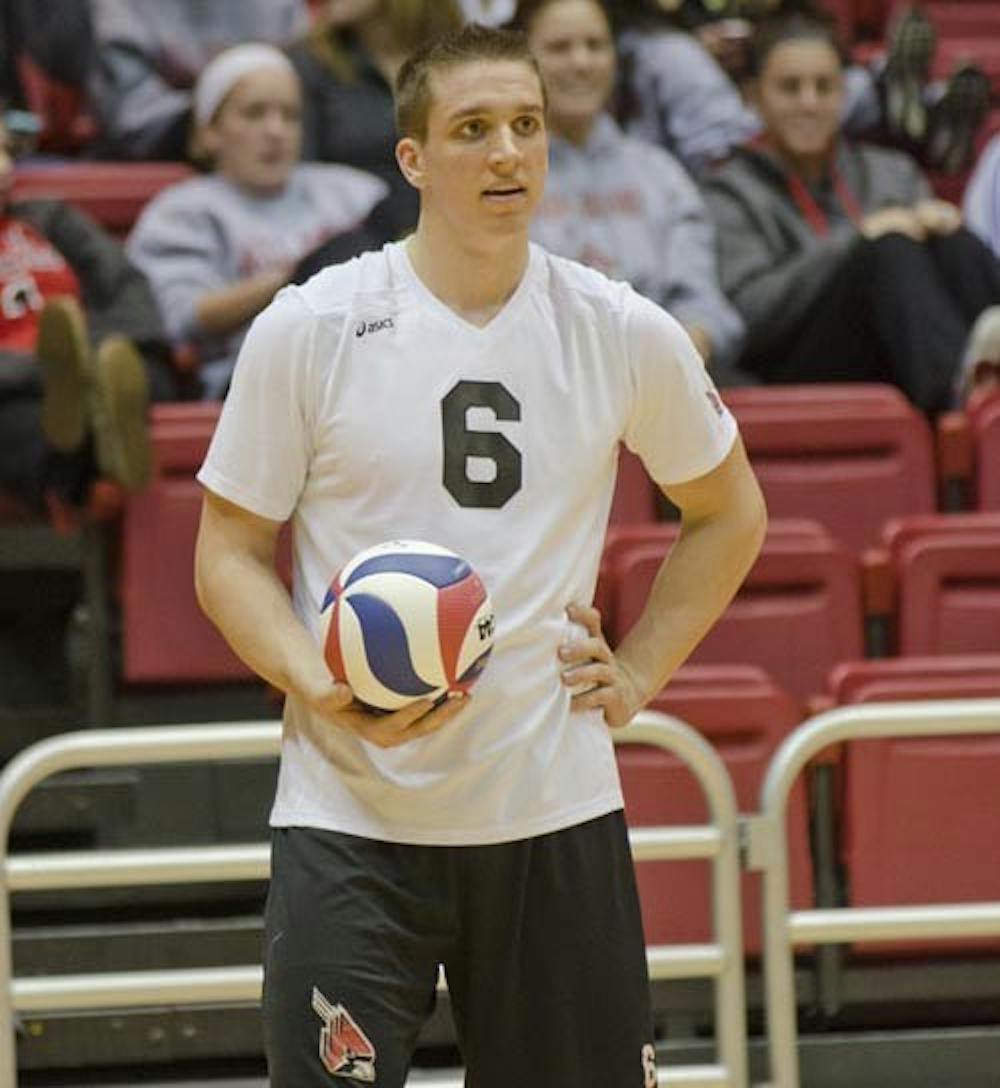 Senior Greg Herceg waits for a referee decision in the game against St. Francis on Jan. 12, 2013. Herceg led the Cardinals with 17 kills against St. Francis. DN PHOTO COREY OHLENKAMP