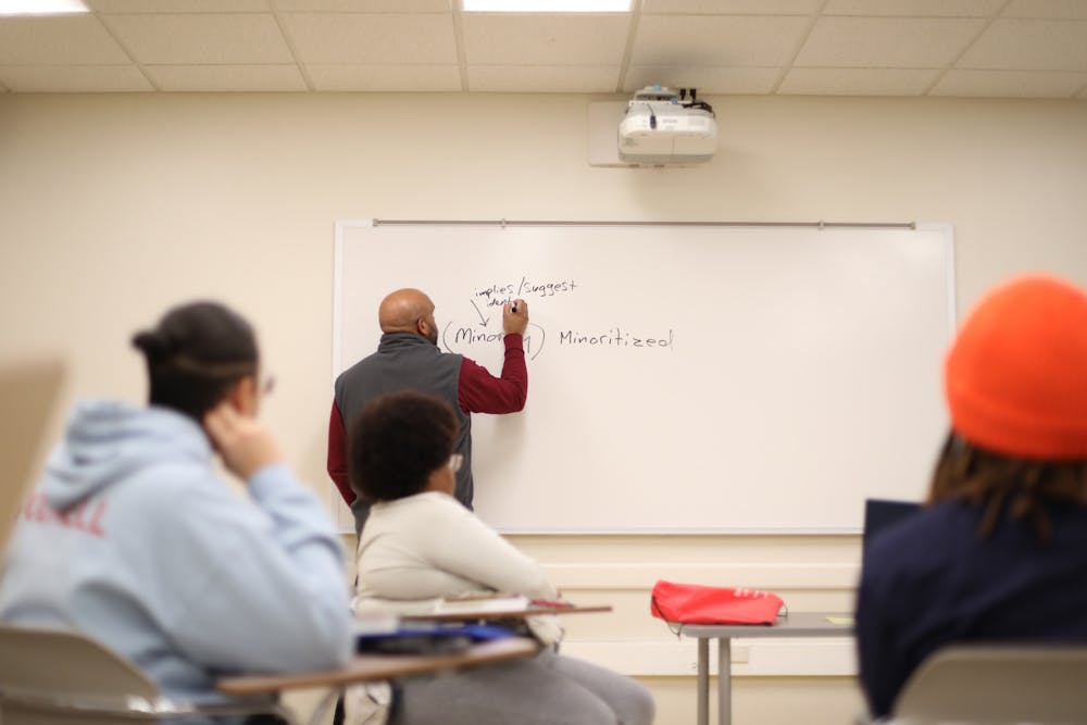 Professor John Anderson writes on the board in his Introduction to African-American Studies class Feb. 14. The African-American studies minor was reintroduced in 2017. Jacy Bradley, DN