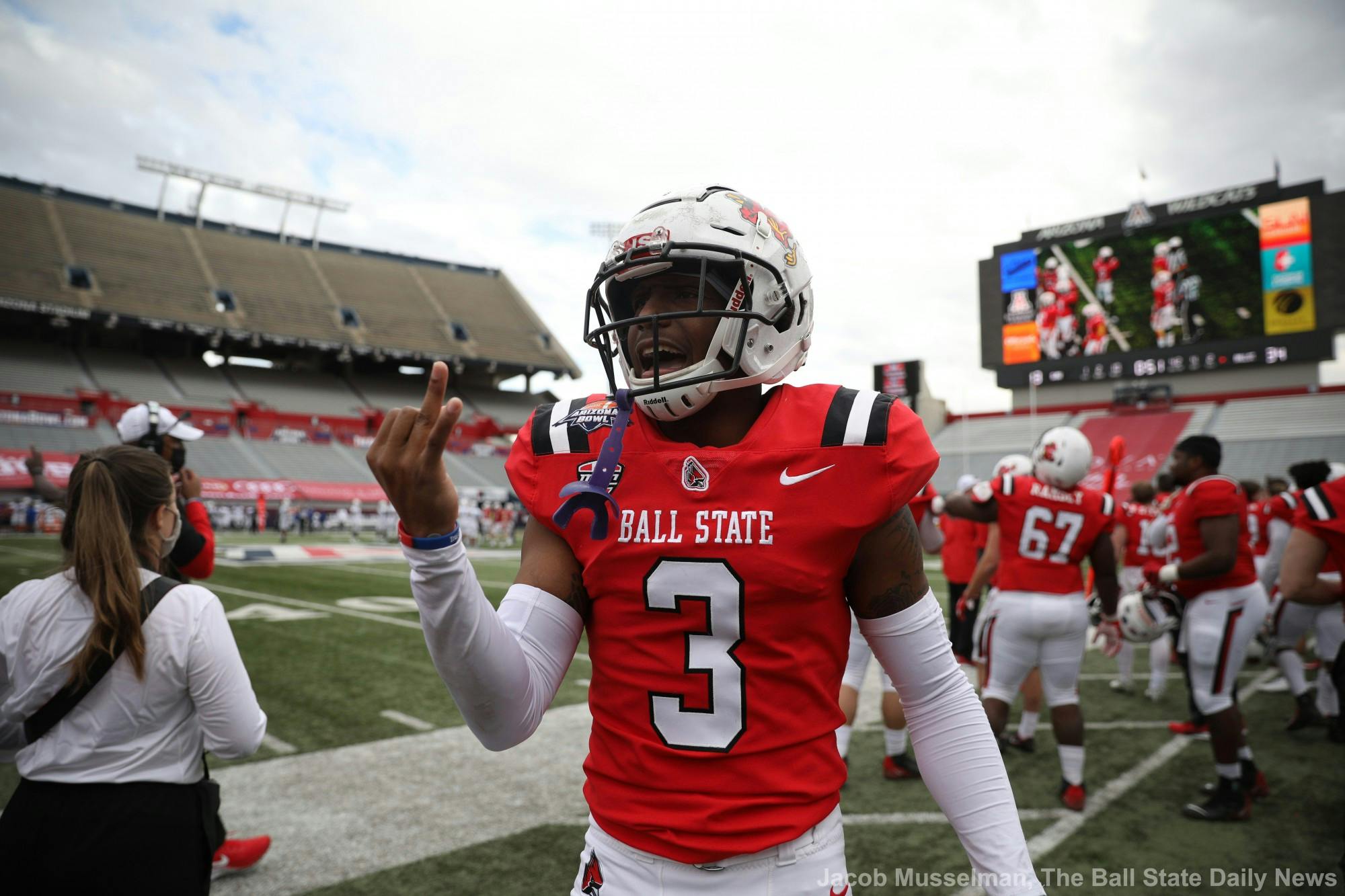 Ball State Cardinals junior cornerback Amechi Uzodinma II celebrates by holding up two fingers for the two championship rings they won during the 2020 season, one for the Mid American Conference Championship and one for winning the Arizona Bowl Dec. 31, 2020, at Arizona Stadium in Tucson, Arizona. The Cardinals won 34-13. Jacob Musselman, DN