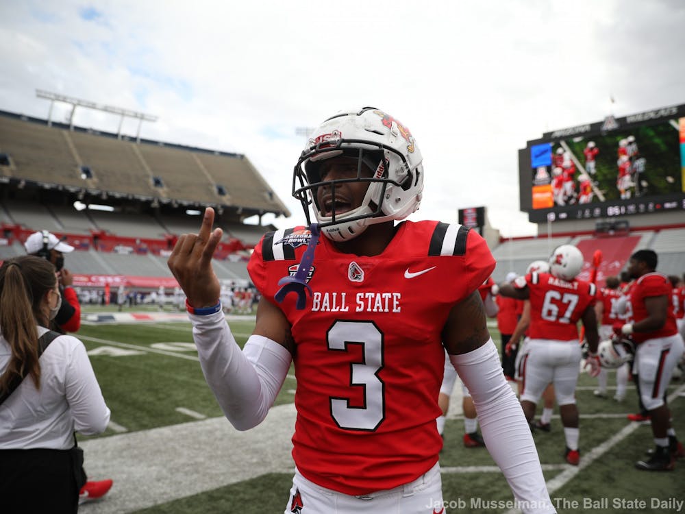 Ball State Cardinals junior cornerback Amechi Uzodinma II celebrates by holding up two fingers for the two championship rings they won during the 2020 season, one for the Mid American Conference Championship and one for winning the Arizona Bowl Dec. 31, 2020, at Arizona Stadium in Tucson, Arizona. The Cardinals won 34-13. Jacob Musselman, DN