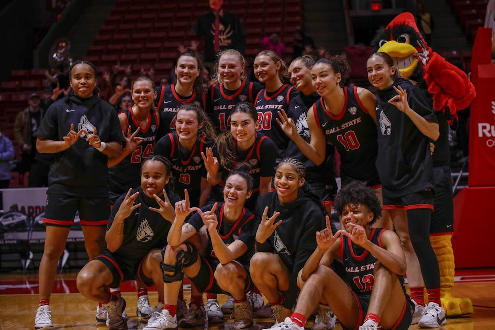 Ball State womens basketball team poses for a picture after their victory against Kent State Jan. 31 at Worthen Arena. The Cardinals defeated the Flashes 57-46. Andrew Berger, DN 