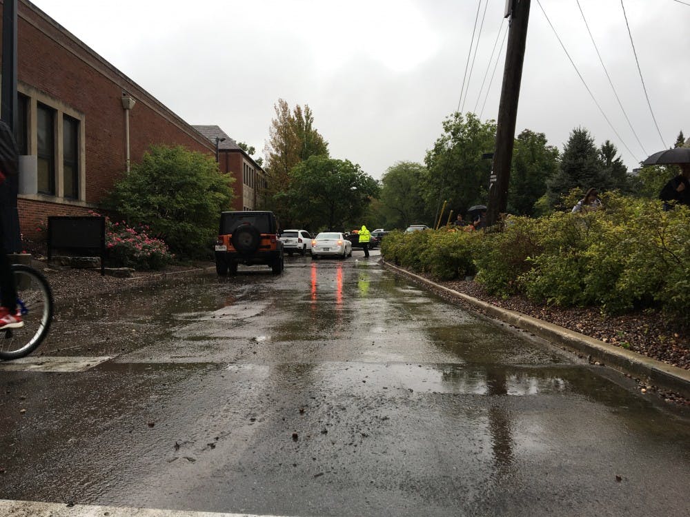 <p>Street between the Cow Path and Applied Technology Building Friday, Sept. 7, 2018. The flooding had subsided after the car had stalled trying move through the waters. <strong>Jake Helmen, DN</strong></p>