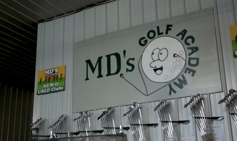 A sign located inside MD’s Golf Academy’s facility. 

